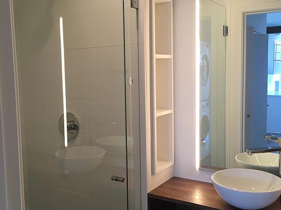 Ceramic tile shower and floor, glass shower door and custom