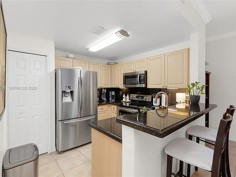 6142 NW 115th Pl #324 — Photo 18