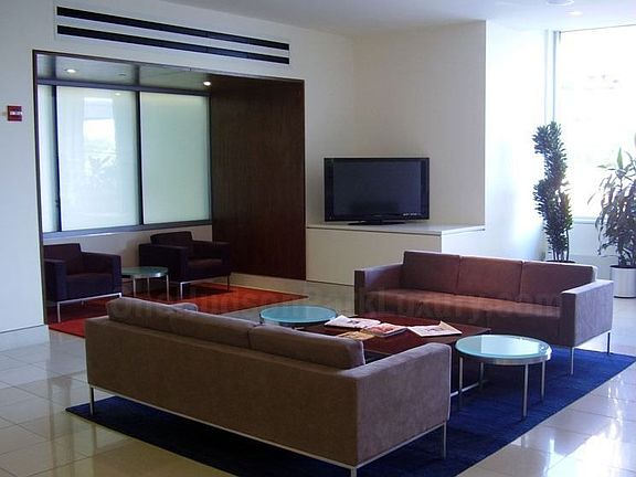 Lobby w/ a Fireplace