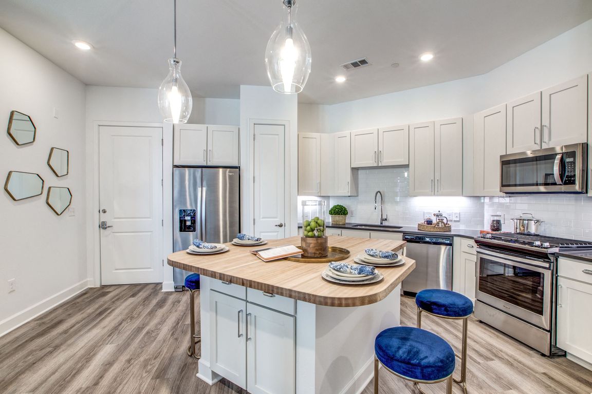 Two Bedroom Model with Butcher Block Islands