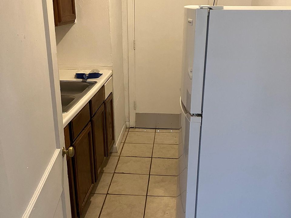 Kitchen area with back door entrance.
