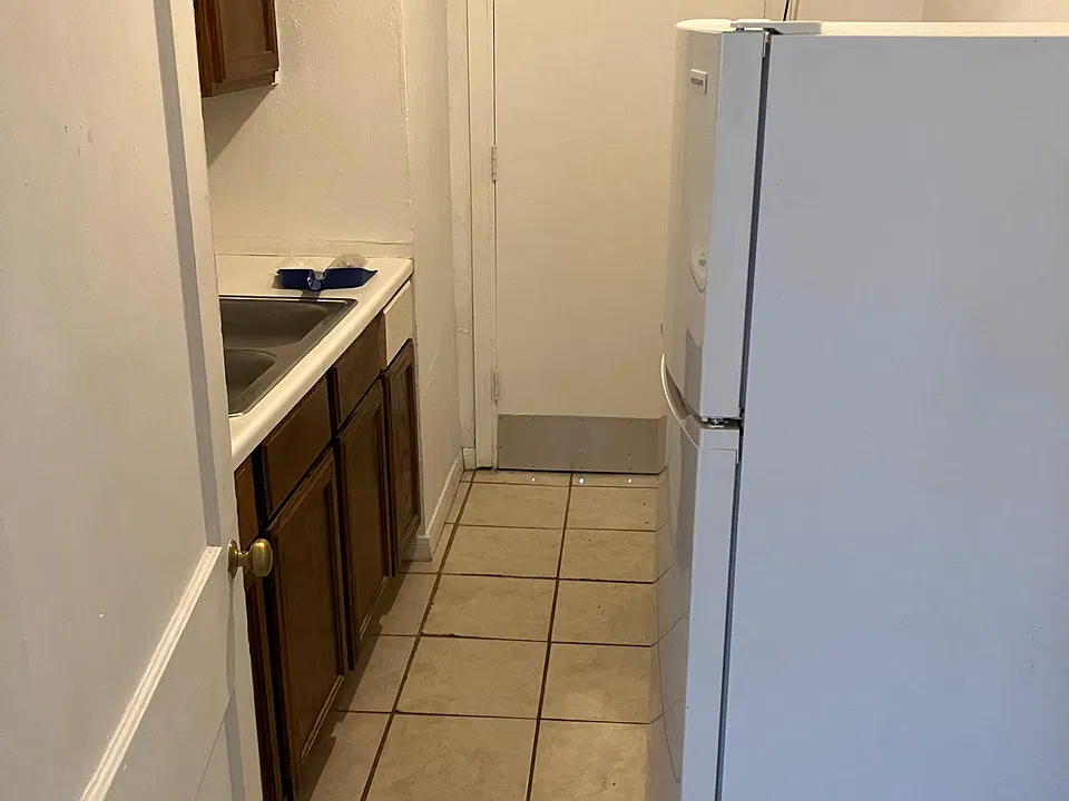 Kitchen area with back door entrance.