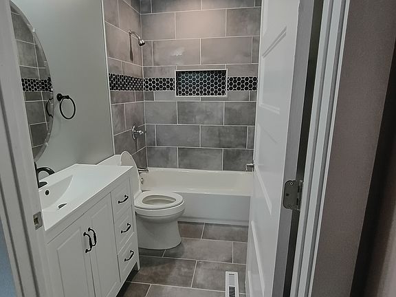 brand new bathroom all new tile vanity and toilet