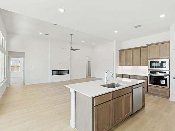 Kitchen in the Gilmour II home plan by Trophy Signature Homes - REPRESENTATIVE PHOTO
