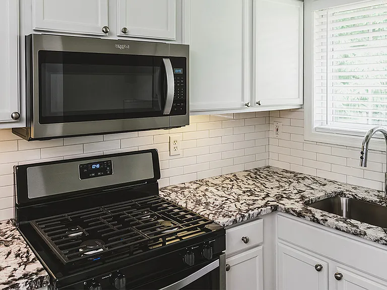 Stainless steel appliances, beautiful granite counters, and upgraded fixtures in our newly reimagined homes