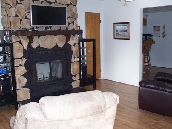 living room w/ wood fireplace