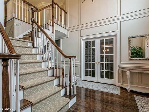 Entry foyer, french doors leading to office/den