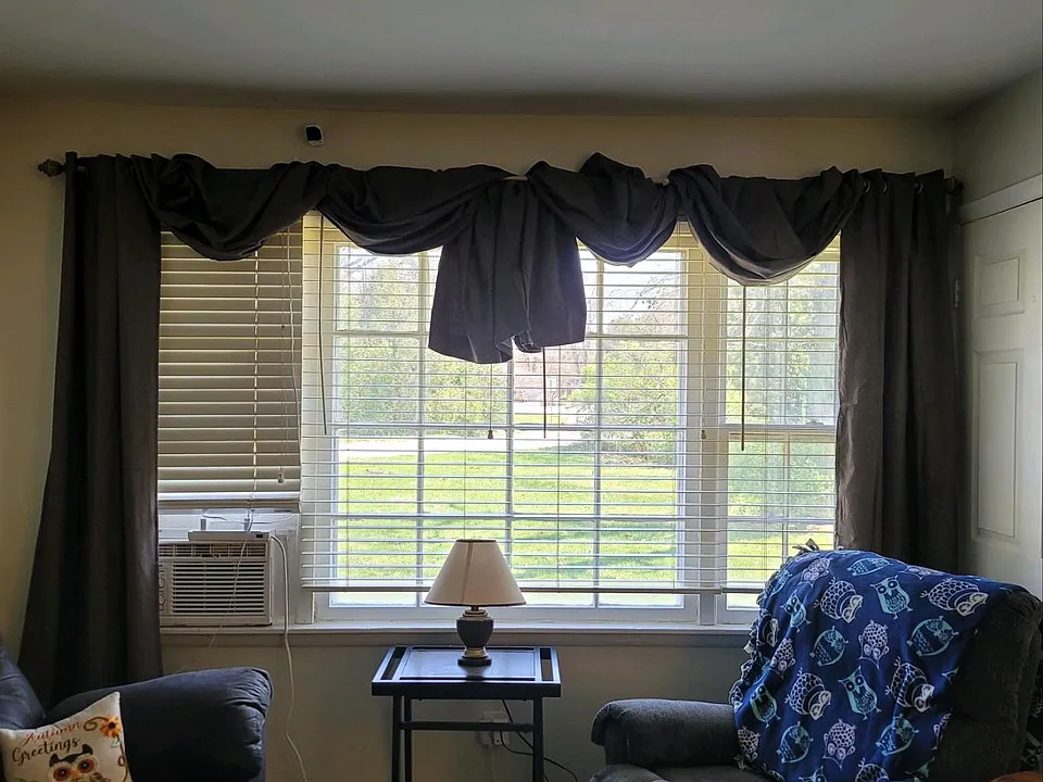 Living room has large window overlooking front yard.