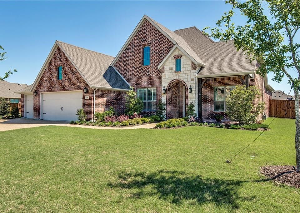 Great curb appeal in the highly sought after The Village of Prosper Trails on a oversized greenbelt!