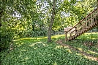 Fenced backyard. Mowing service is included.