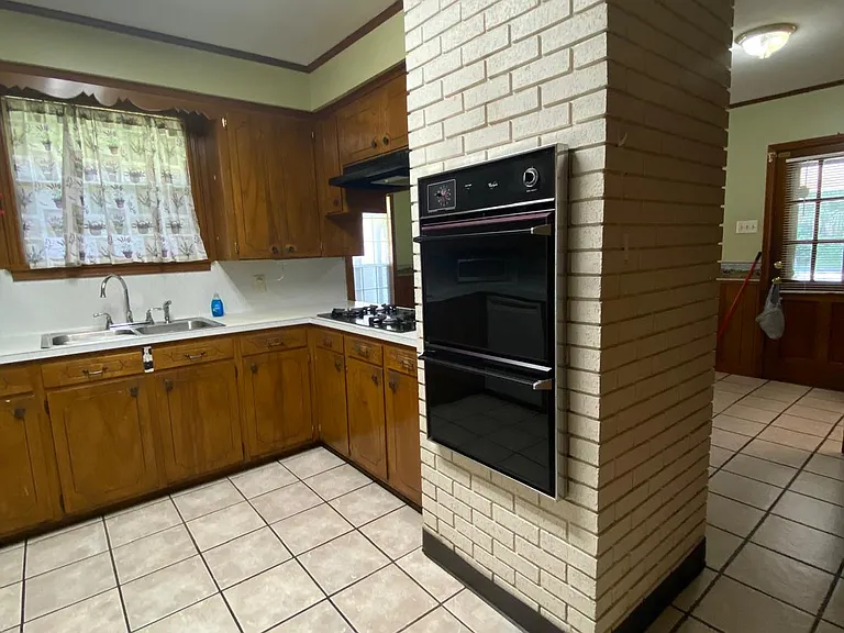 Kitchen (two ovens). The kitchen has been freshly painted white.