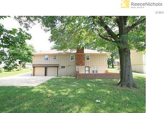 Back of Home with 2 new garage doors with openers