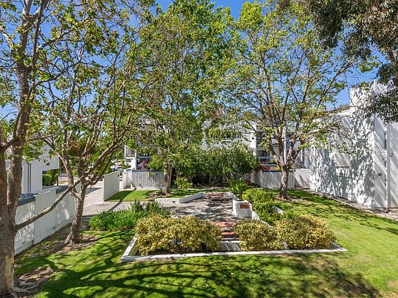 View of the courtyard from our balcony. There is a BBQ and picnic tables