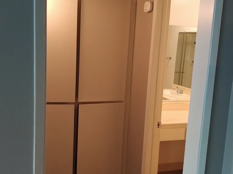 Storage cabinets at guest bathroom