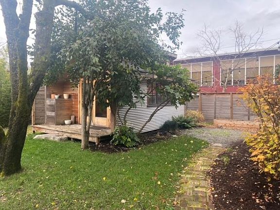 Raised planters for garden and gravel seating area.