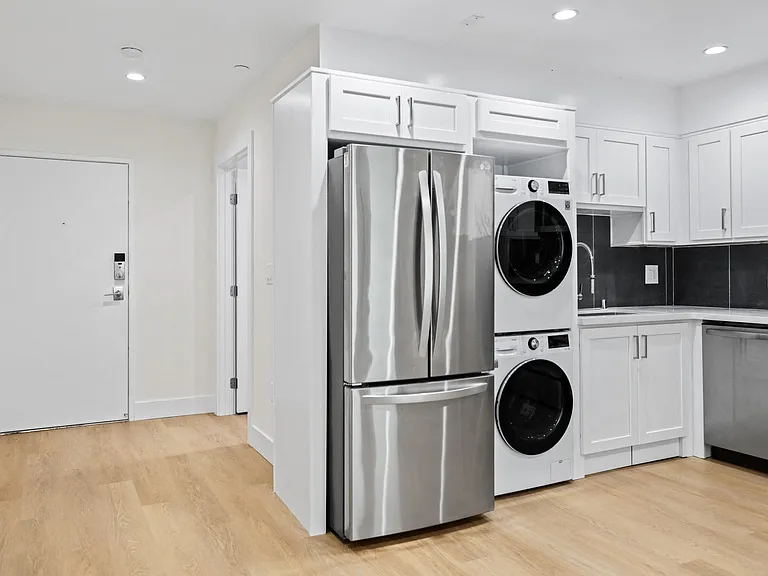 Front Entrance of Unit and In-Suite Washer & Dryer