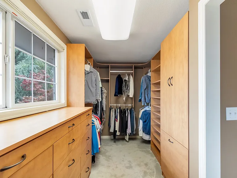 Primary closet with plenty of storage