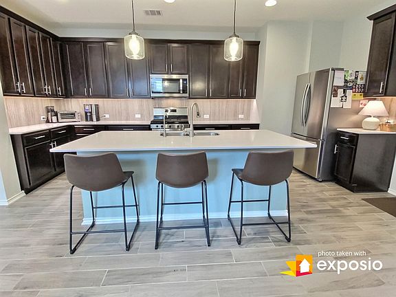 Spacious kitchen with large island. Refrigerator included in rental.