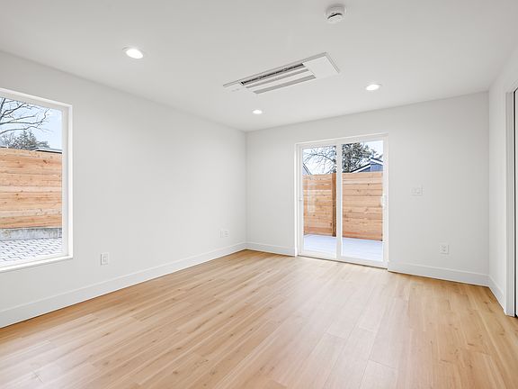 Living Room with sliding glass door to deck and yard.