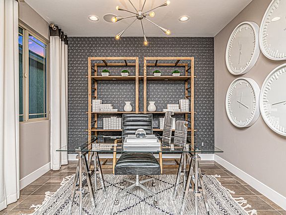 Enjoy a den that can be utilized as a home office, craft space, and more