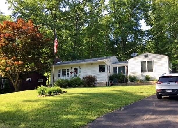 Front view. Paved wide driveway