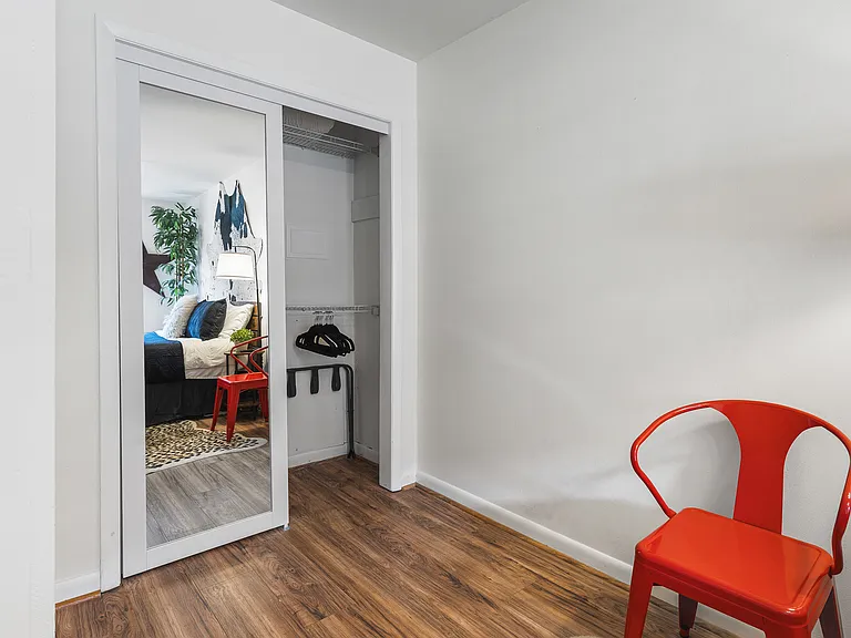Comfortable King bed in the bedroom. Includes a smart TV, desk to get ready at, dresser and a closet to store your items in.