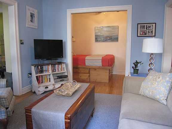 Living Room with bed behind