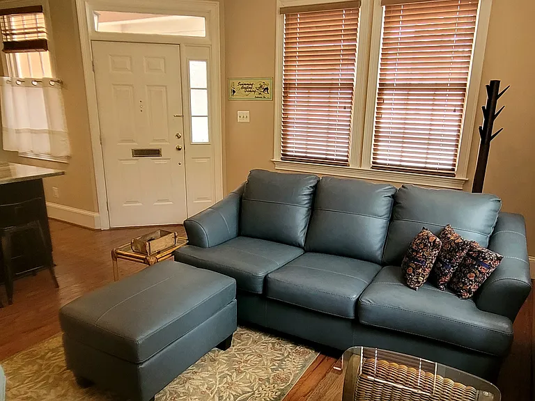 Spacious livivg room wrap around windows view the courtyard. Very private and quiet.