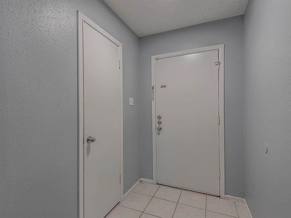 Tiled front foyer with coat closet as you walk in!