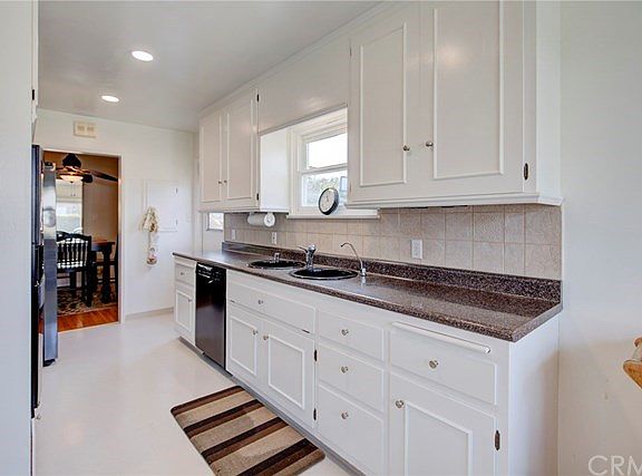 There is a access door to the side yard from the kitchen.