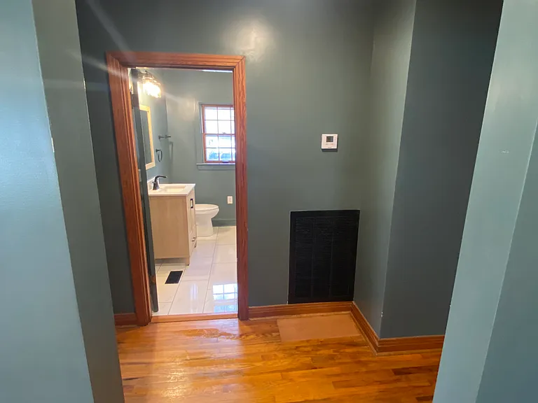 Bathroom straight ahead from the living room entry, one bedroom to the left and 2 bedrooms to the right.
