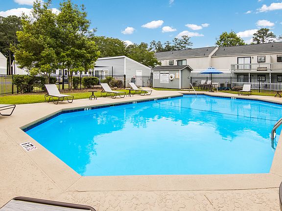 Sparkling pool with lounge chairs