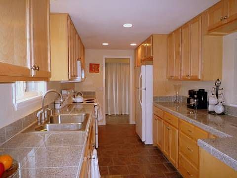 Well-lit Kitchen w/Granite Countertops