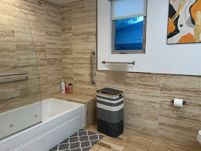 Master bathroom with a jacuzzi
