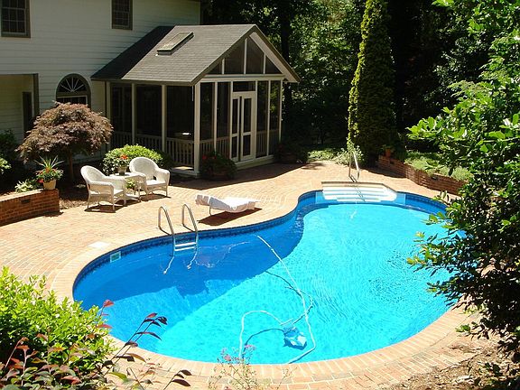 Pool surrounded by landscaping
