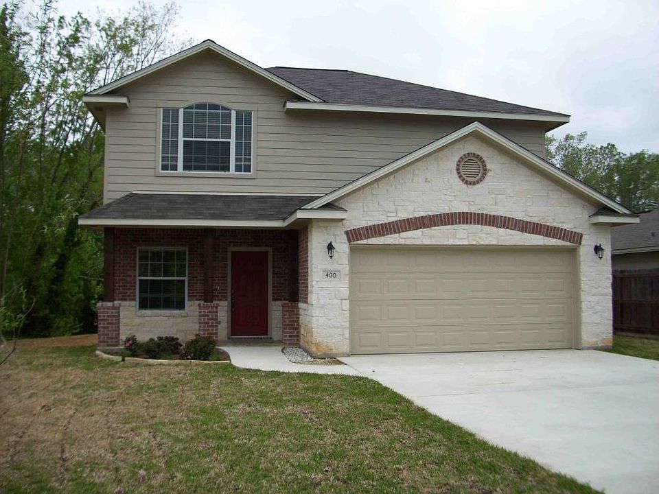 exterior brick and stone with siding on the sides and rear