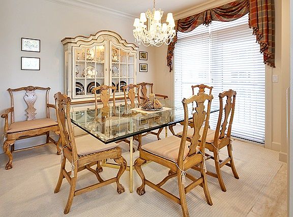 Custom Strauss crystal chandelier sets off the dining room with its deck and see through fireplace f