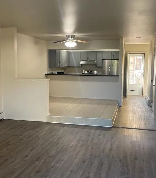 Dining and Kitchen area from living room. Also back door access =