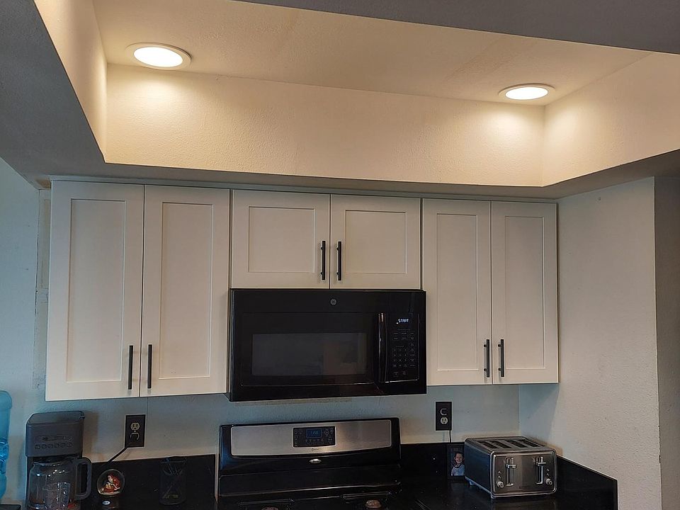 Bright kitchen day or night! View of the pool from dining room...