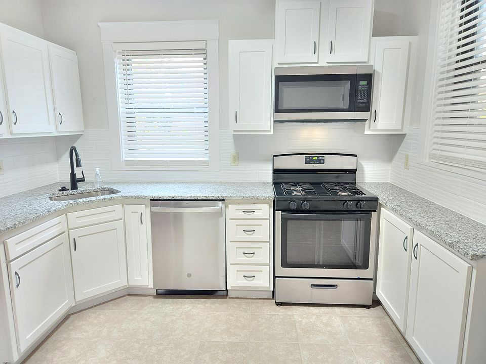 Updated kitchen with stainless appliances and granite countertops
