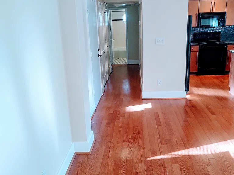 View from living room to hallway leading to bedrooms and bathroom.