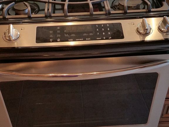 Slide in gas range