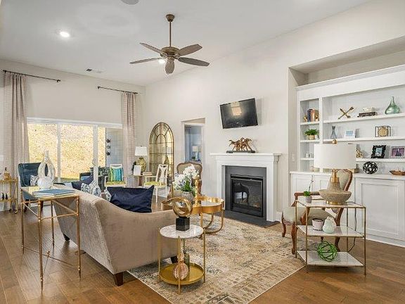 Open concept living with high ceilings! Photo is a representation of home.