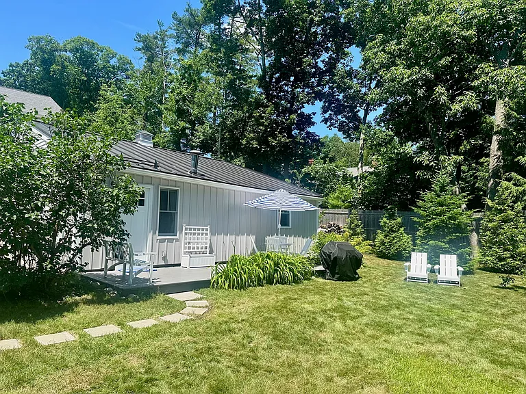Large and private side deck with expansive lawn. Great for morning coffee or outdoor dining.