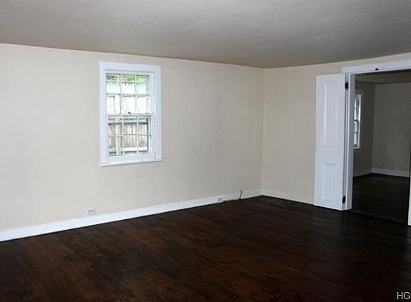 Living room leads to den.