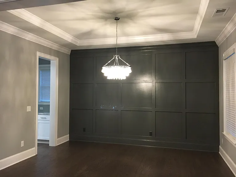 Formal dining room with wainscotting