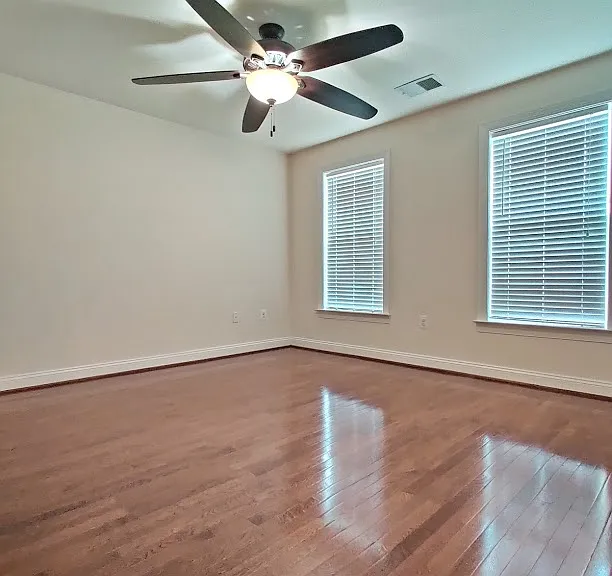 Master bedroom with hardwood floor on 3rd floor