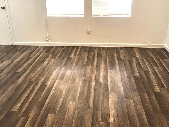 Living room with new floors and blinds