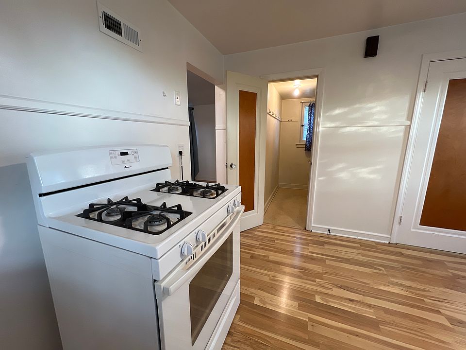 Gas range with entrance to pantry shown just behind