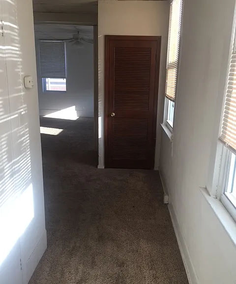 Walk from the kitchen to closet on left, front brown doors is the furnace. this is walking towards the livingroom